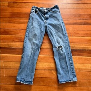 Levi’s straight leg jeans with small tear on knee. Size 32.